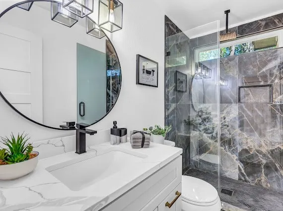 a bathroom with a sink toilet and shower