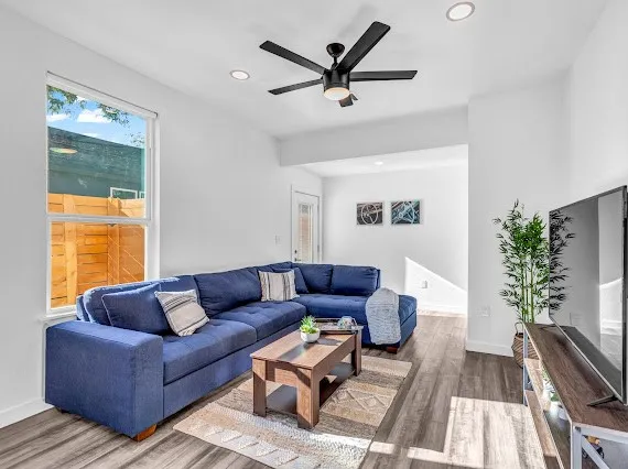 a living room with furniture and a large window
