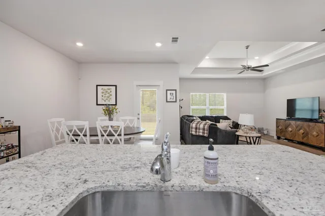 a living room with furniture and a table