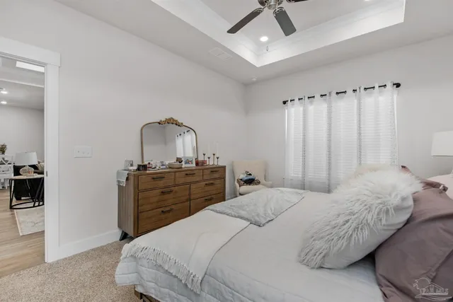 a bedroom with a bed and a dresser