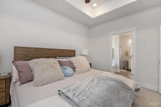 a bedroom with a bed and a night stand