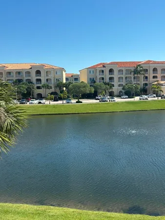 a view of a swimming pool with a yard