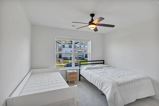 a bedroom with a bed furniture and window