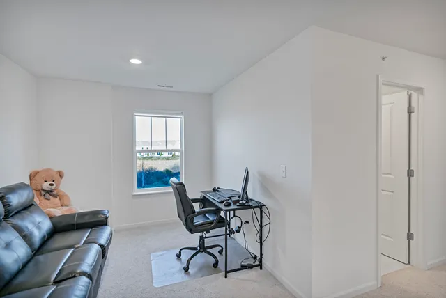 a workspace with furniture and a window