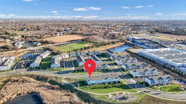 an aerial view of residential houses with outdoor space