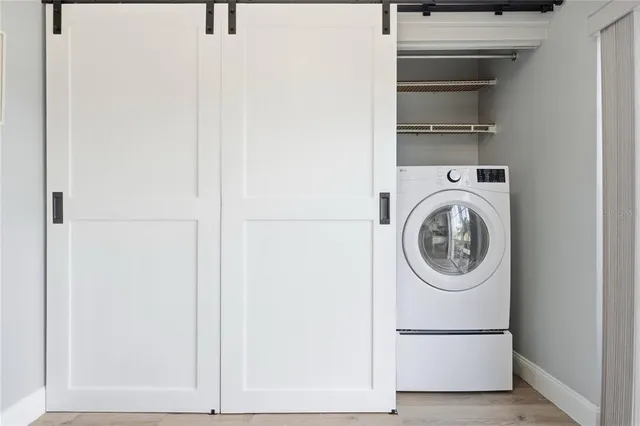 a utility room with dryer and washer