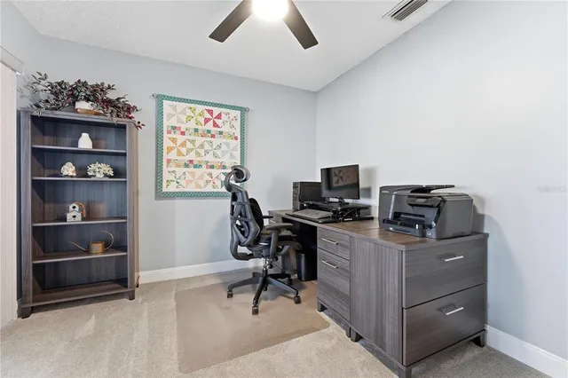 a view of a workspace with furniture