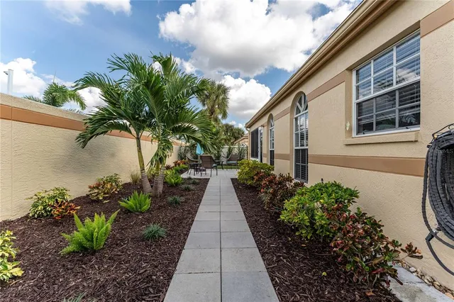 a potted plant sitting in front of a house