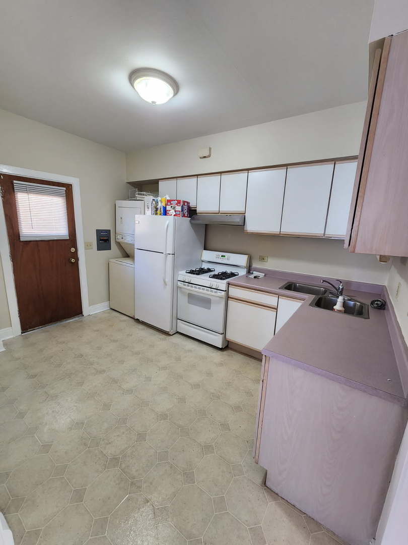 48 Crystal Street, Unit 2F Cary, IL 60013 - Photo 4 of 6 a storage room with washer and dryer