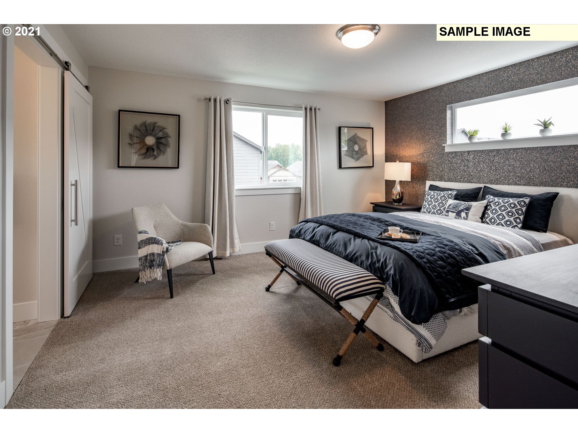 2944 South Harper Valley Way Ridgefield, WA 98642 - Photo 15 of 21 a bedroom with a bed and a couch