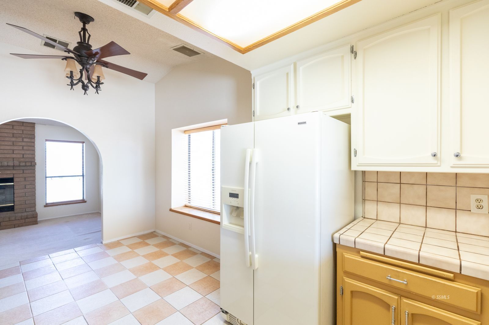 240 Richard Court Ridgecrest, CA 93555 - Photo 11 of 34 a view of a refrigerator and window in a kitchen