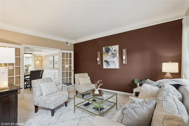 a bed room with a bed and a chandelier