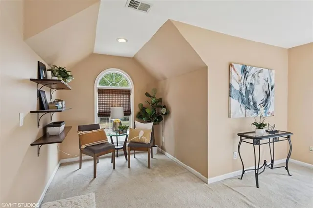 a living room with a large window and a table