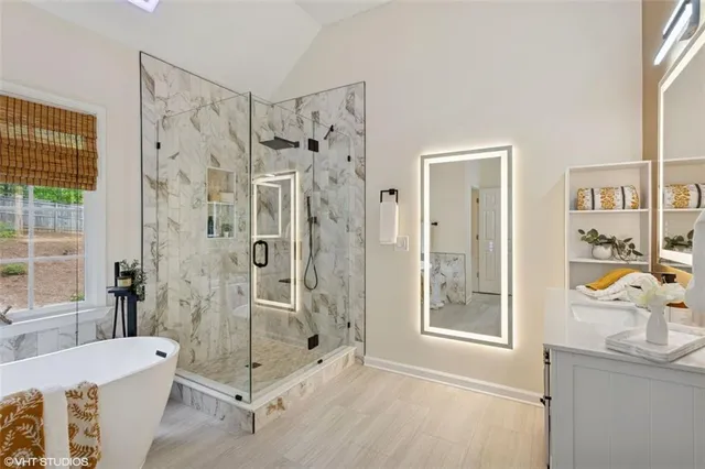 a white bath tub sitting next to a window