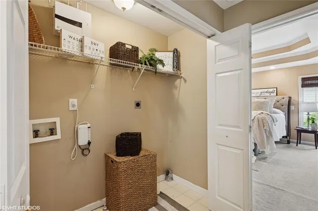 a view of a house with backyard and chairs