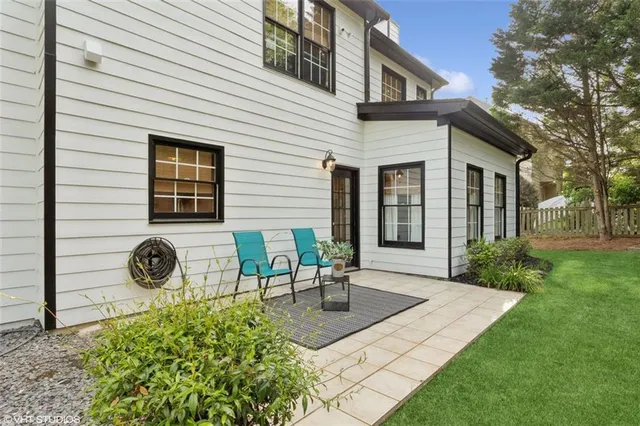 a view of a house with a yard porch and sitting area