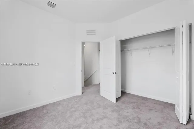 a bathroom with a double vanity sink and mirror