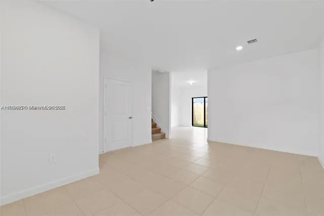 a kitchen with a cabinets and white stainless steel appliances
