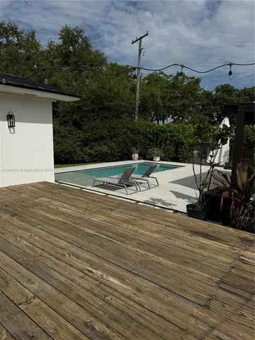 a view of kitchen with sink and microwave