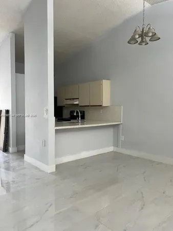 a view of kitchen and sink