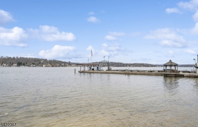 3 Prospect Street, Unit 2D Mount Arlington, NJ 07856 - Photo 17 of 20 a view of a lake with houses in the back