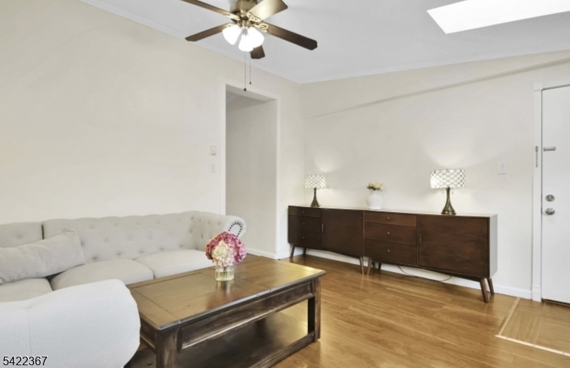 3 Prospect Street, Unit 2D Mount Arlington, NJ 07856 - Photo 2 of 20 a living room with furniture and a table