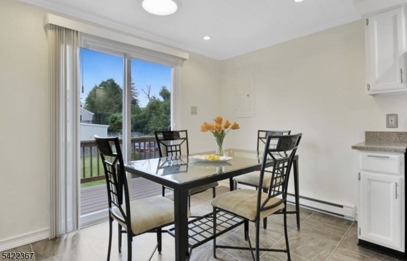 3 Prospect Street, Unit 2D Mount Arlington, NJ 07856 - Photo 3 of 20 a view of a dining room with furniture and a potted plant