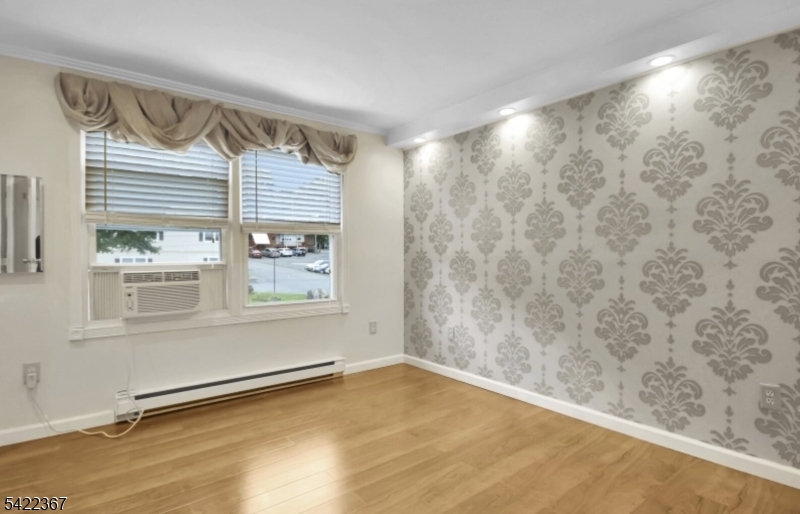 3 Prospect Street, Unit 2D Mount Arlington, NJ 07856 - Photo 6 of 20 a view of an empty room and a window