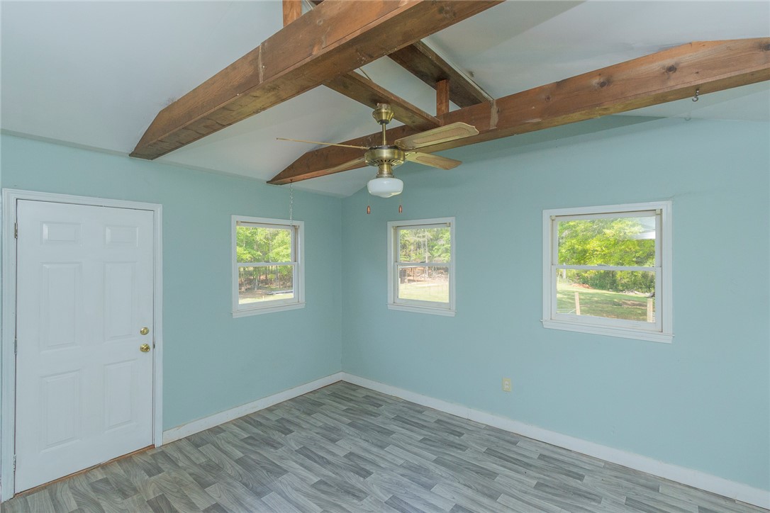 820 Travis Road Anderson, SC 29626 - Photo 19 of 46 This airy room features exposed ceiling beams and abundant natural light.