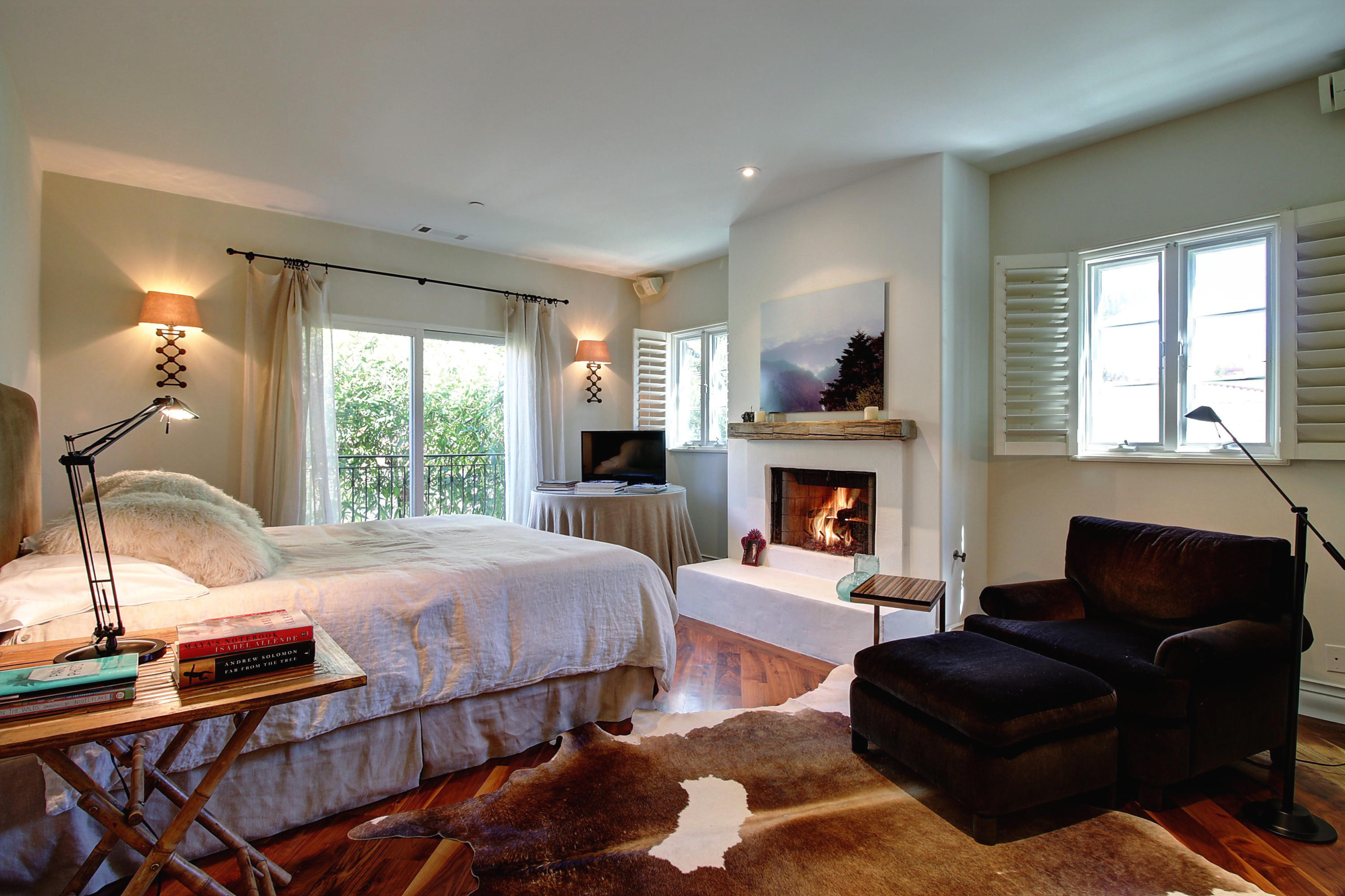 71 Olive Mill Road Montecito, CA 93108 - Photo 11 of 22 a bedroom with furniture and a fireplace