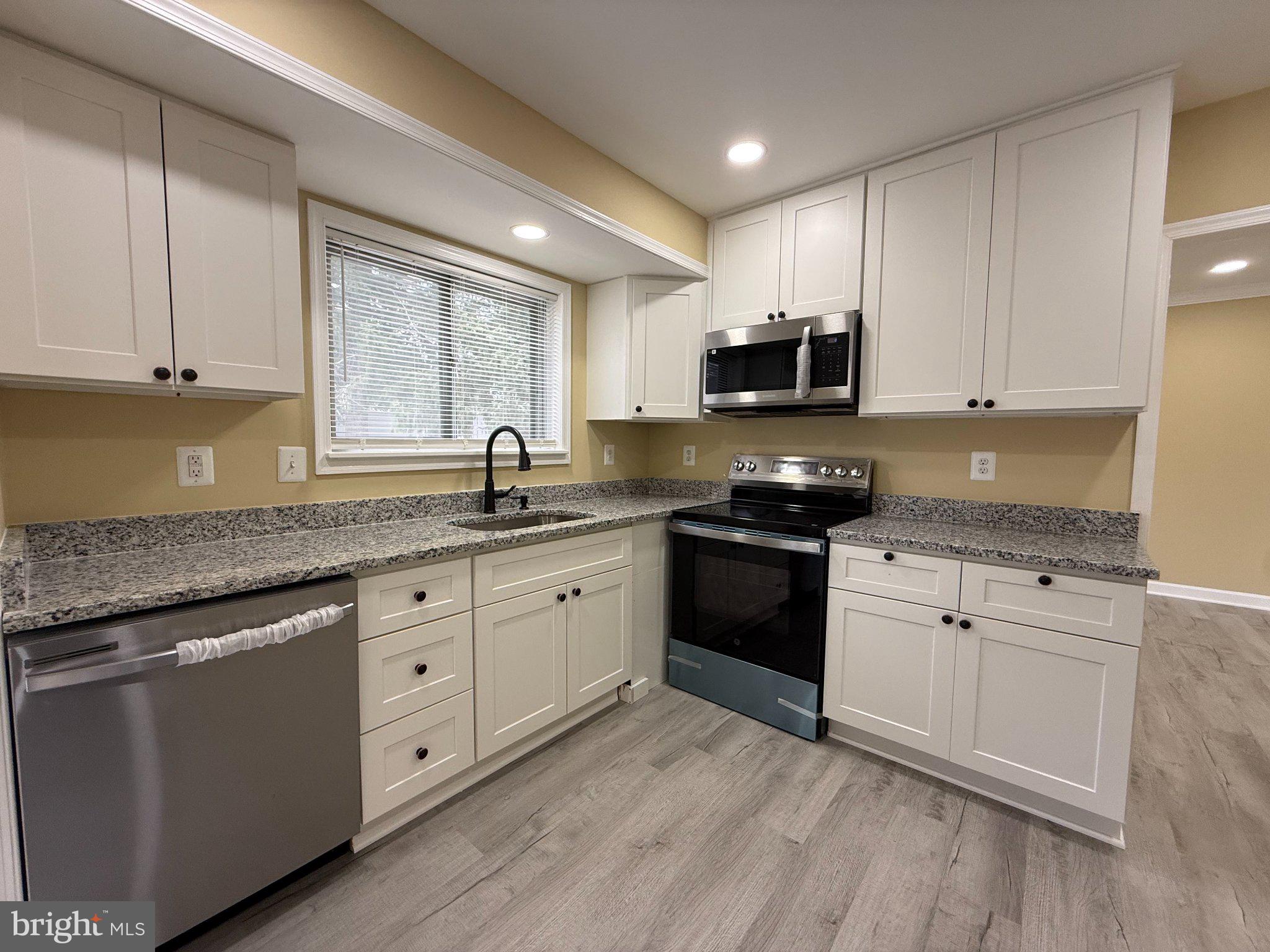6909 Digby Road Gwynn Oak, MD 21207 - Photo 12 of 48 Kitchen with New Countertops and Appliances