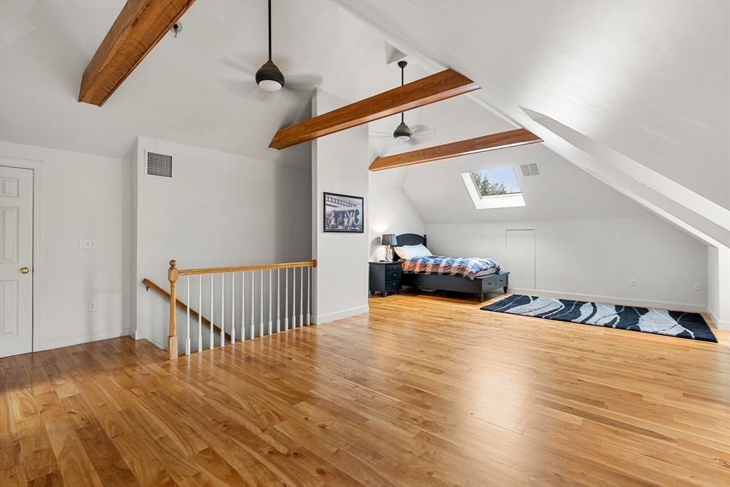 37 Old Planters Road Beverly, MA 01915 - Photo 33 of 42 a bedroom with furniture and wooden floor
