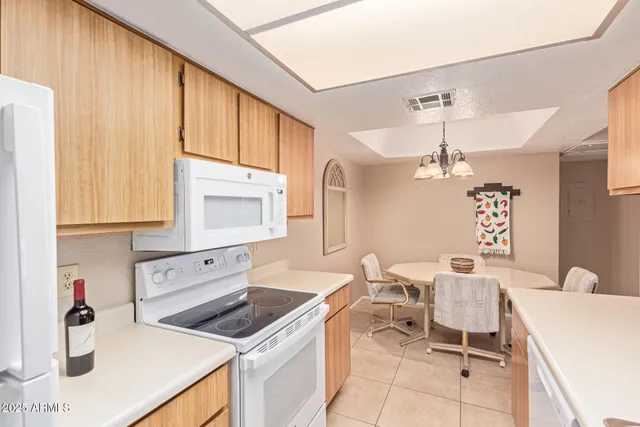 a kitchen that has a sink and a stove