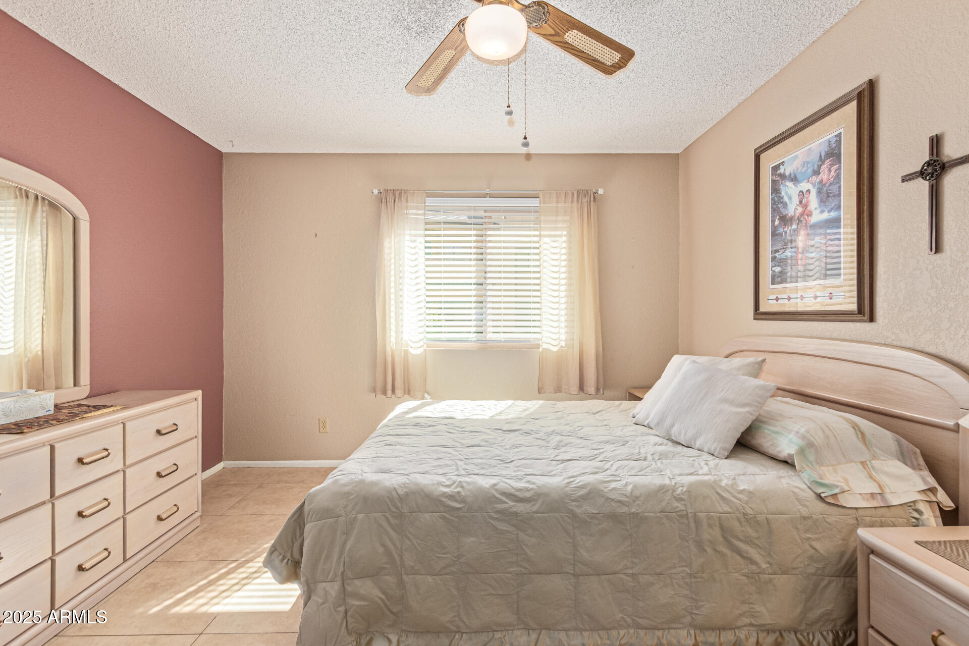145 North 74th Street, Unit 127 Mesa, AZ 85207 - Photo 17 of 34 a bedroom with a large bed and a window