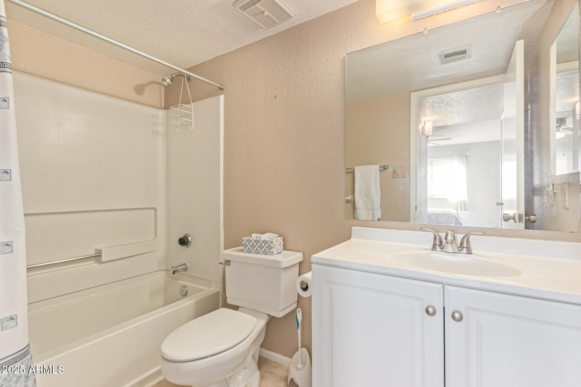 145 North 74th Street, Unit 127 Mesa, AZ 85207 - Photo 18 of 34 a bathroom with a sink a toilet and shower