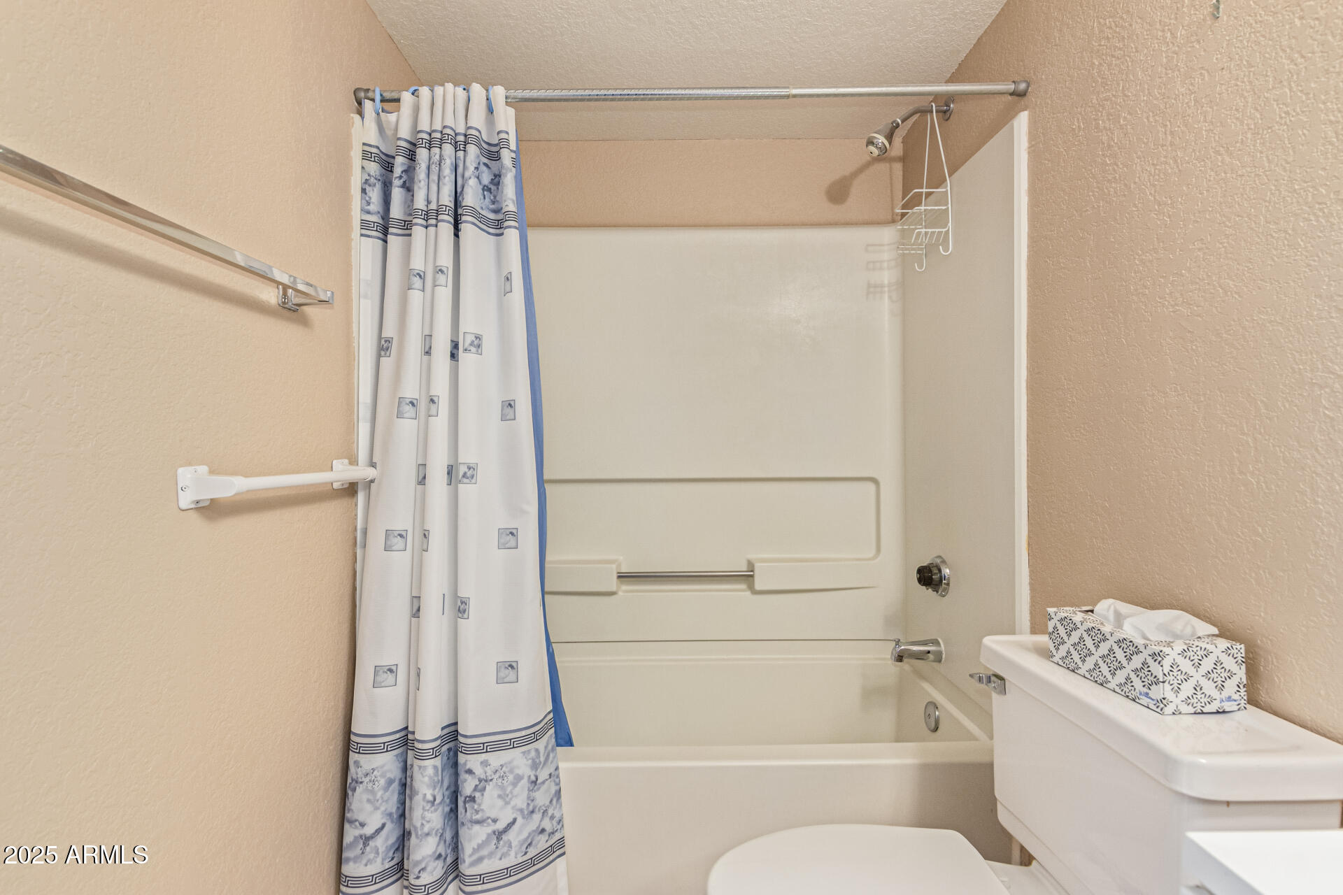 145 North 74th Street, Unit 127 Mesa, AZ 85207 - Photo 19 of 34 a bathroom with a shower a toilet and a shower