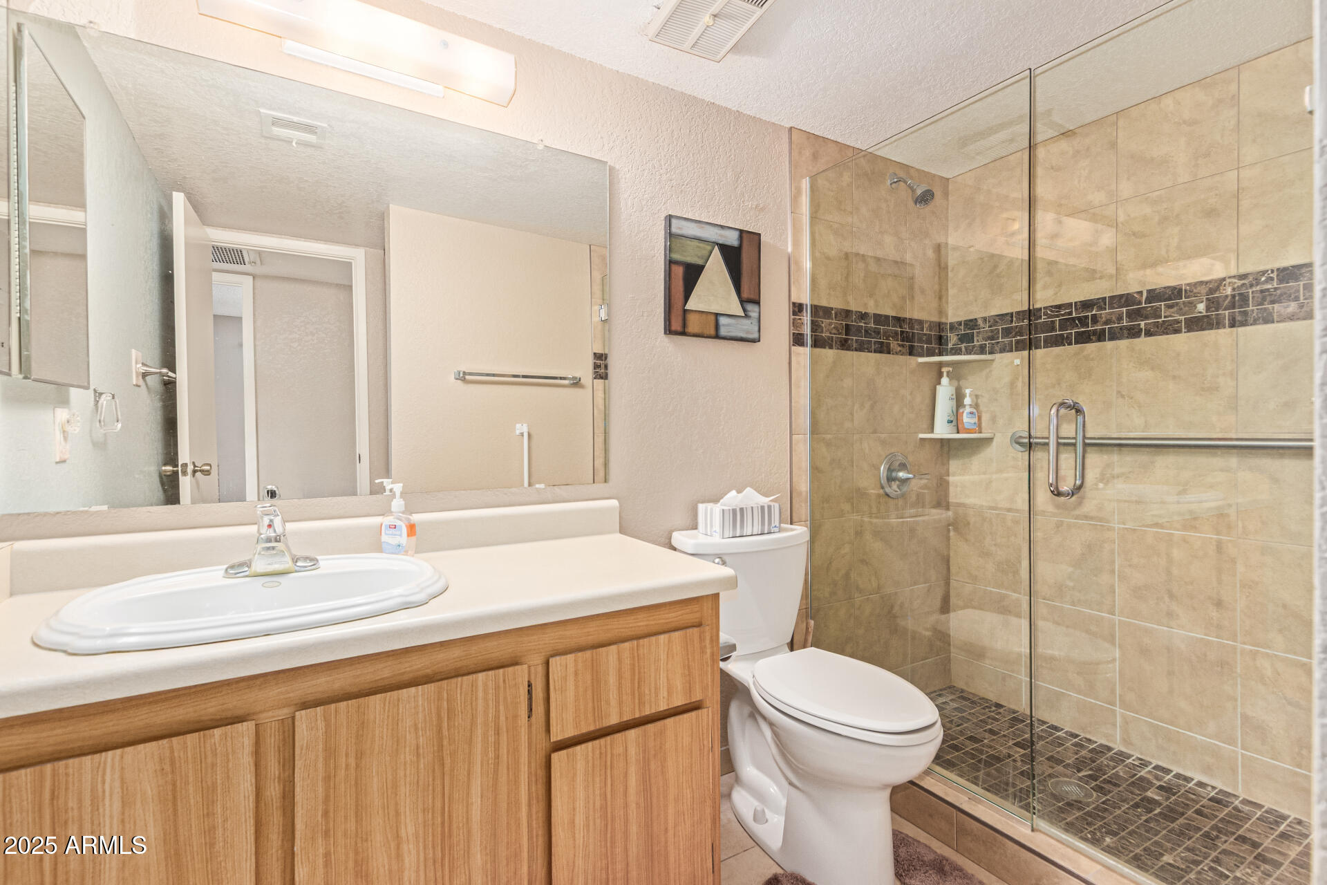 145 North 74th Street, Unit 127 Mesa, AZ 85207 - Photo 24 of 34 a bathroom with a sink toilet and shower