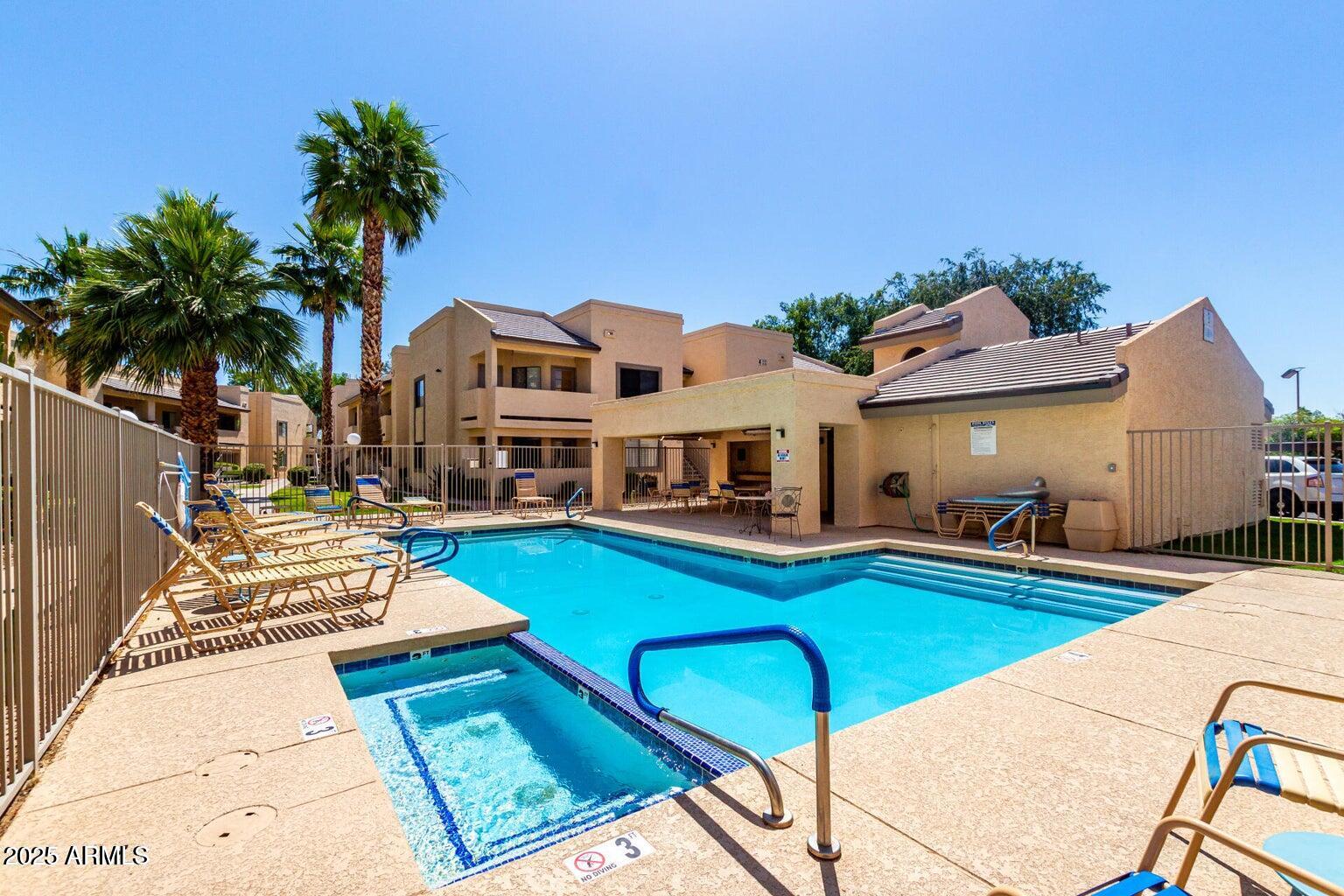 145 North 74th Street, Unit 127 Mesa, AZ 85207 - Photo 27 of 34 a view of a house with swimming pool and sitting area