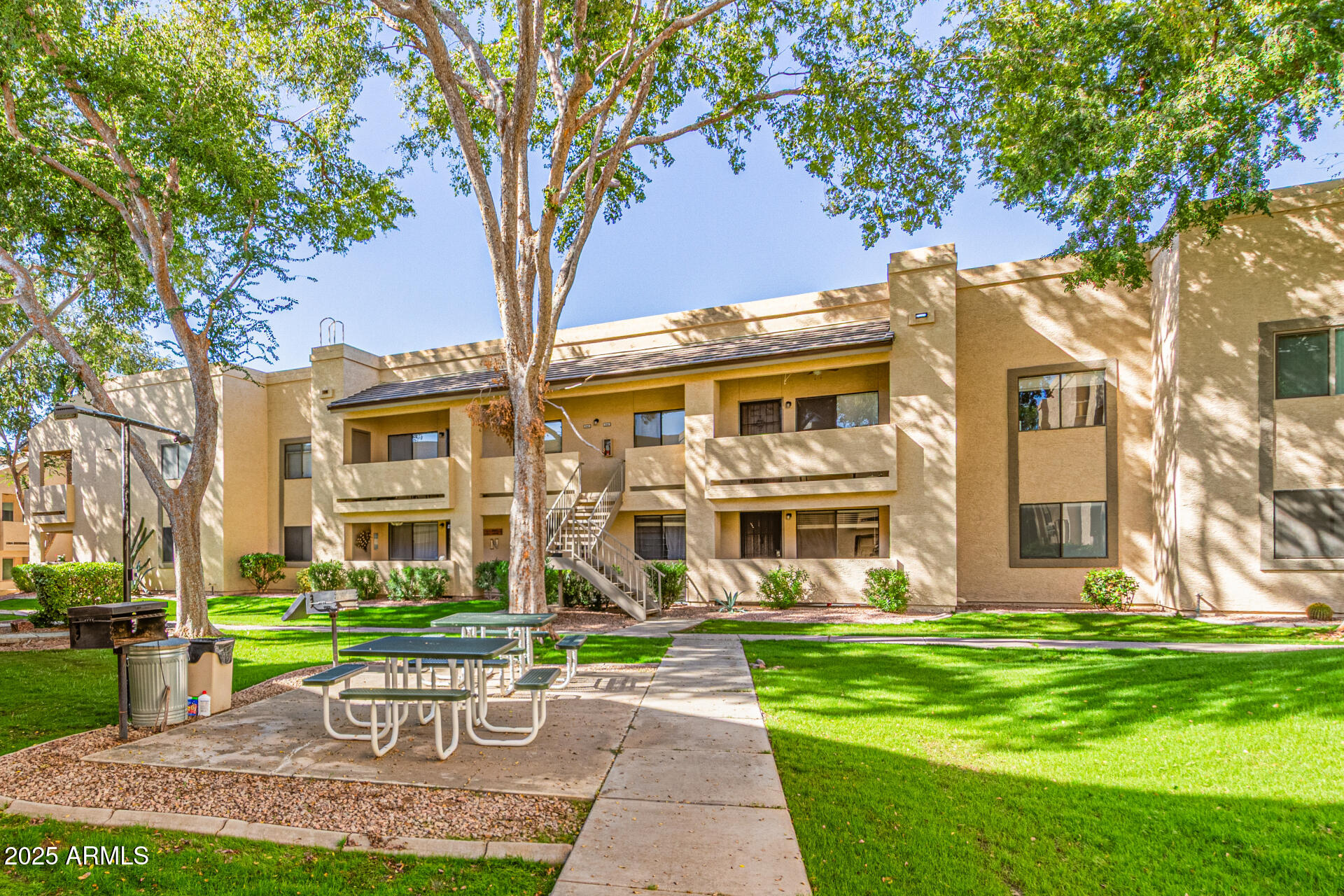 145 North 74th Street, Unit 127 Mesa, AZ 85207 - Photo 32 of 34 a front view of a building with a garden