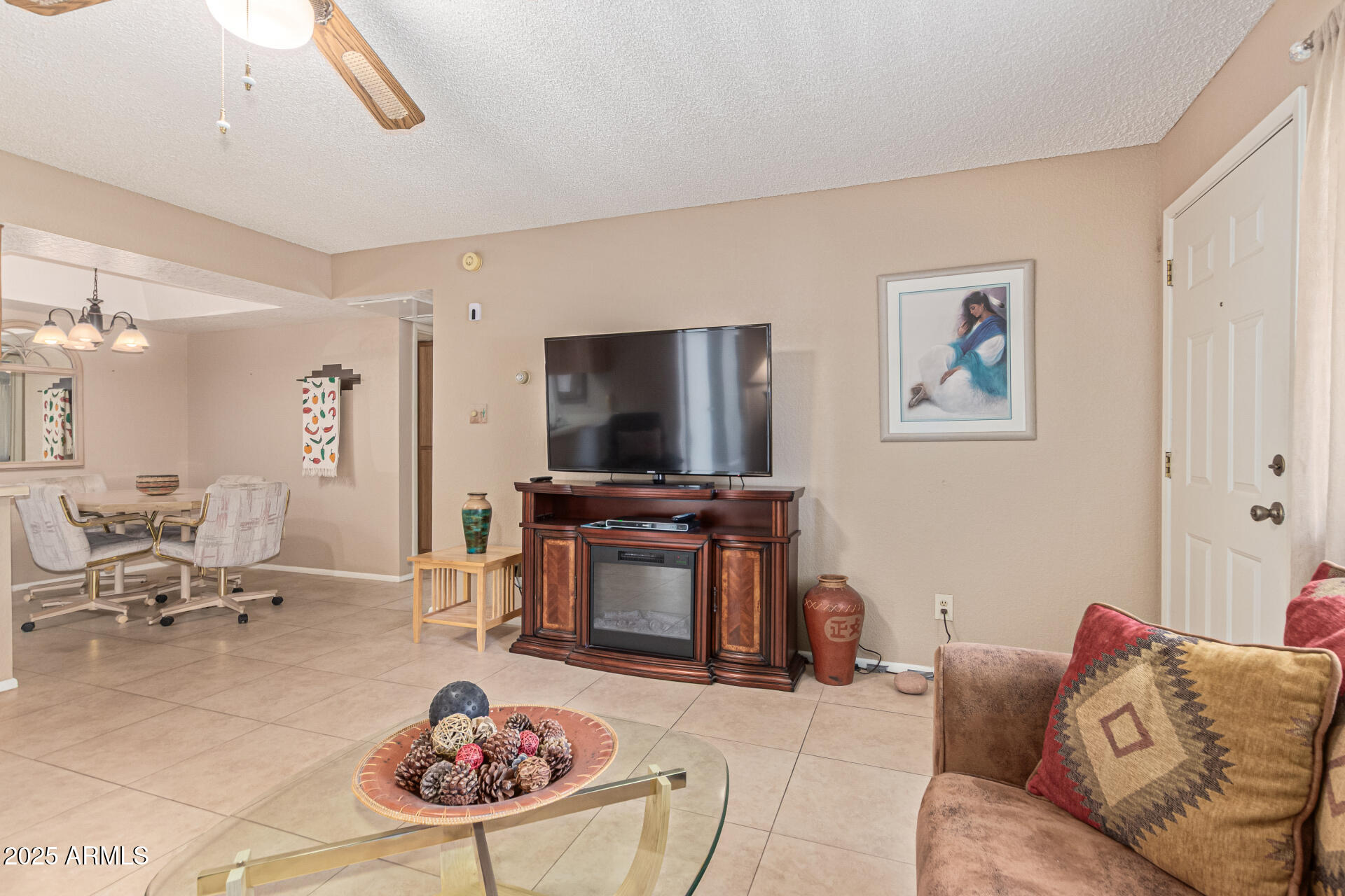 145 North 74th Street, Unit 127 Mesa, AZ 85207 - Photo 6 of 34 a living room with furniture and a flat screen tv