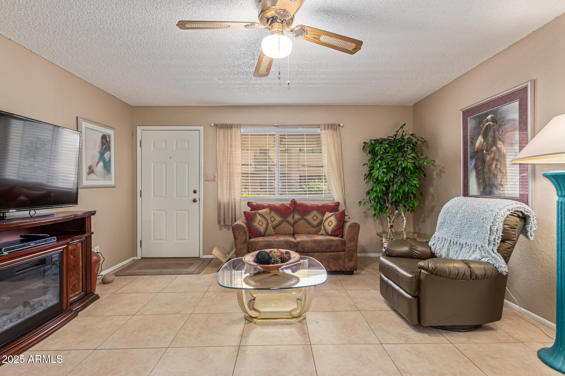 145 North 74th Street, Unit 127 Mesa, AZ 85207 - Photo 7 of 34 a living room with furniture and a flat screen tv