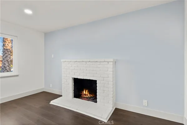 a living room with a fireplace and a fireplace