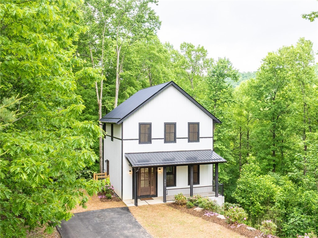131 Bryce Way Boone, NC 28607 - Photo 4 of 38 a front view of a house with a garden