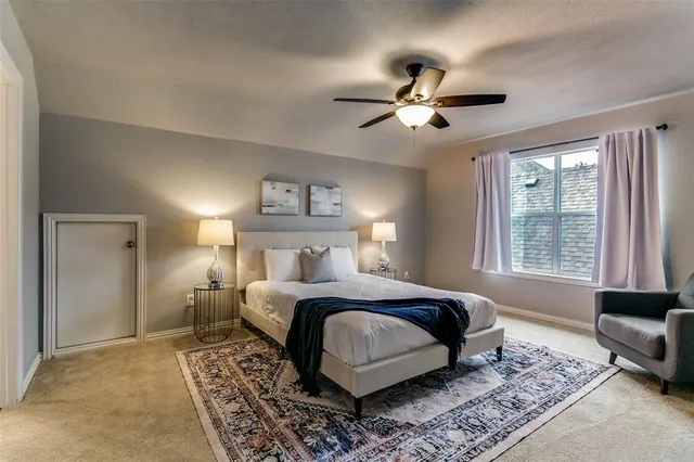 a bedroom with a large bed and a couch