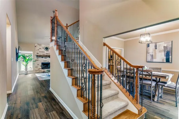 a view of entryway and hall with wooden floor