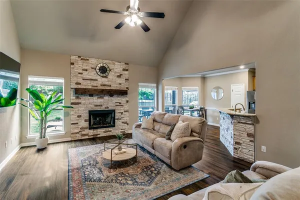 a living room with furniture and a fireplace