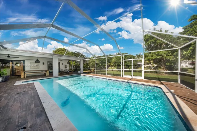 a view of house with a swimming pool