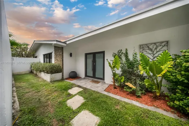 a front view of a house with garden