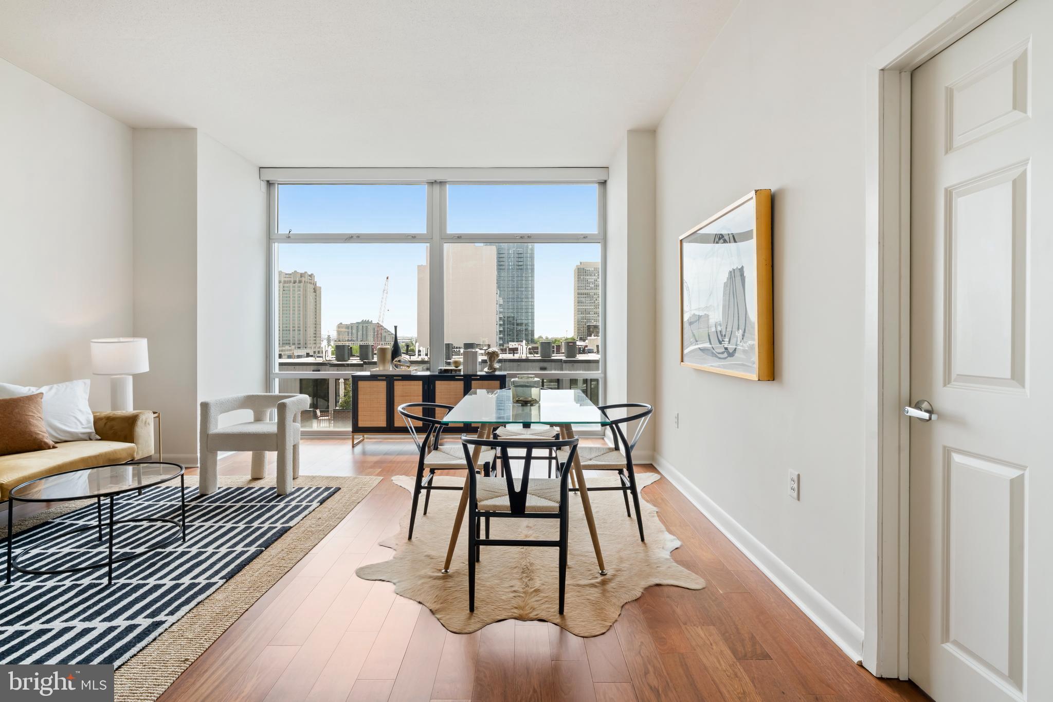 22 South Front Street, Unit 603 Philadelphia, PA 19106 - Photo 1 of 44 a living room with furniture and a large window