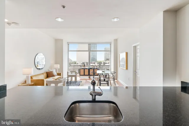 a kitchen with a sink and a large window